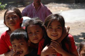 AMI Lombok Masbagik Timur pottery village happy smiling kids with red T-shirts 4 3008x2000