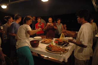 AMI Lombok Ombak Putih sailing ship open air buffet for dinner on lower deck 1 3008x2000