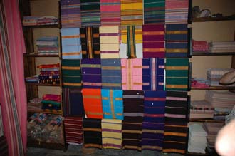 AMI Lombok Pringgasela traditional weaving village colourful clothes in a shop 1 3008x2000