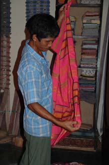 AMI Lombok Pringgasela traditional weaving village colourful clothes in a shop 2 3008x2000