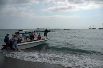AMI Lombok Senggigi Ombak Putih sailing ship passengers boarding the dinghy on the beach 3008x2000