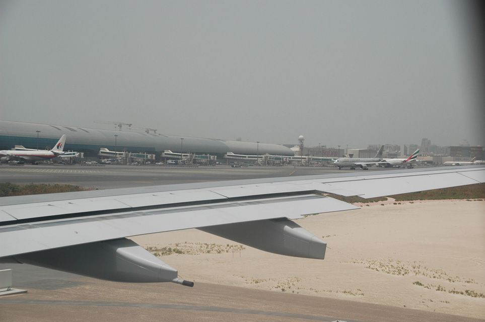 DXB Dubai International Airport - Terminal 1 with aircrafts on the gates 3008x2000